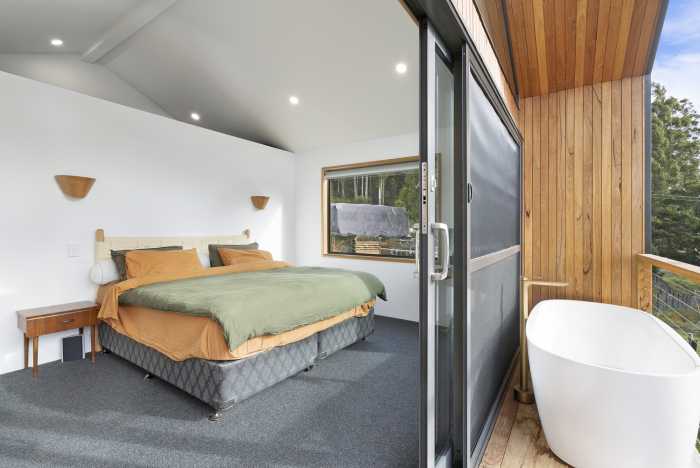 Spacious Main Bedroom joining onto Timber Deck with Outdoor Bathtub
