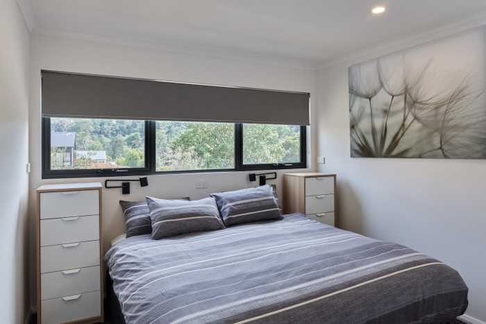Guest Bedroom with Large Overhead Window
