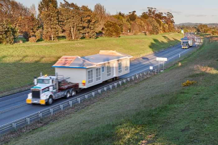 2 Trucks Transporting Modular Home through Tasmania